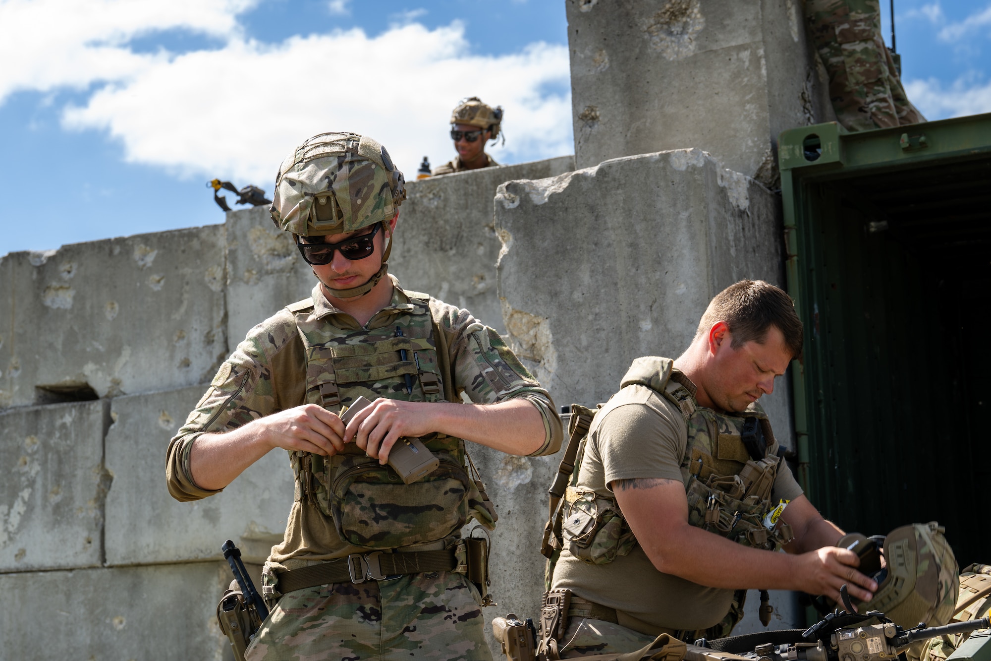 Men suit up to head out in the field.