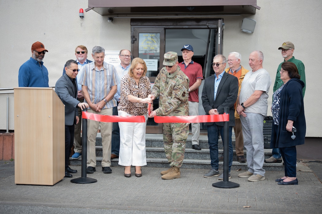 Service members cut a ribbon for ceremony