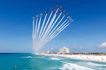 The Navy’s Blue Angels and the Air Force’s Thunderbirds conduct a Super Delta flyover off Pensacola Beach, Fla., April 14, 2026. The Super Delta formation highlights precision, discipline and teamwork. (U.S. Air Force photo)