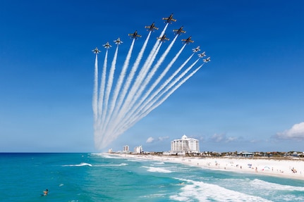 The Navy’s Blue Angels and the Air Force’s Thunderbirds conduct a Super Delta flyover off Pensacola Beach, Fla., April 14, 2026. The Super Delta formation highlights precision, discipline and teamwork. (U.S. Air Force photo)