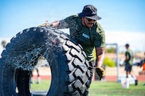 Senior Airman Isaiah Nichols, 99th Communications Squadron, moves a tire during the Nellis Operational Readiness Trials at Nellis Air Force Base, Nev., April 10, 2026. The event tested teamwork, endurance and mission-focused execution across the installation. (U.S. Air Force photo by Airman Annika Schermerhorn)
