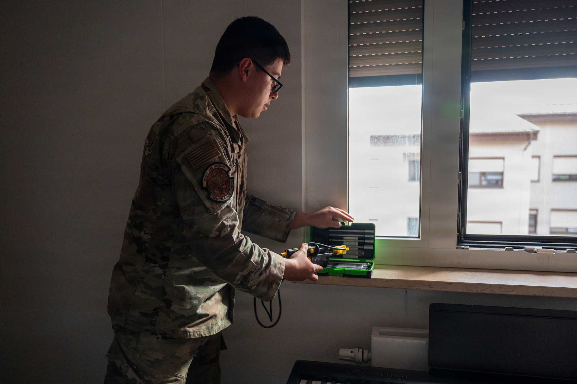 A Airman organizes their tool kit
