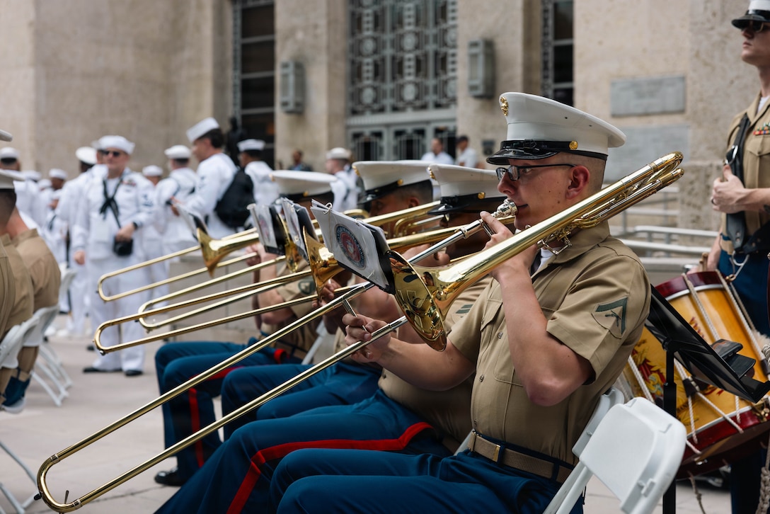 U.S. Marine Corps LCpl. Ethan Frending, a trombone player with the Quantico Marine Corps Band performs for the opening ceremony at Houston City Hall in Houston, Texas, April 15, 2026. Fleet Week is a celebration of the U.S. Navy, Marine Corps, and Coast Guard, typically held in various cities across the United States. It features a parade of Navy and Coast Guard ships, public ship tours, and a variety of events honoring military service, with the city of Houston being the first time in its history hosting the event. (U.S. Marine Corps photo by Cpl. Darien Wright)