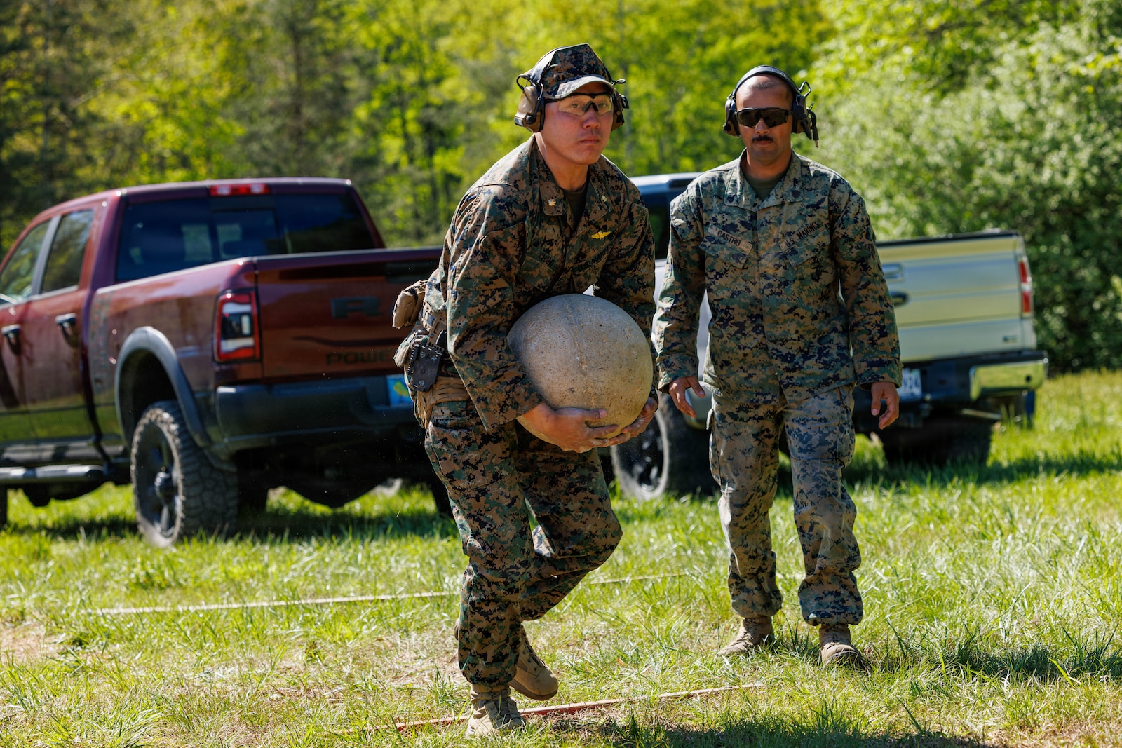 U.S. Marine Corps Maj. Sean Chang, an instructor course supervisor with Marine Force Reserves, carries an atlas ball to the next challenge during the Marine Corps Marksman Competition at Weapons Training Battalion on Marine Corps Base Quantico, April 21, 2026. The competition showcases the Marine Corps’ top emerging shooters from regional competitions to determine the top rifle and pistol competitors, while also featuring team matches, night fire, and counter-UAS marksmanship. (U.S. Marine Corps photo by Lance Cpl. Federico Marquez)