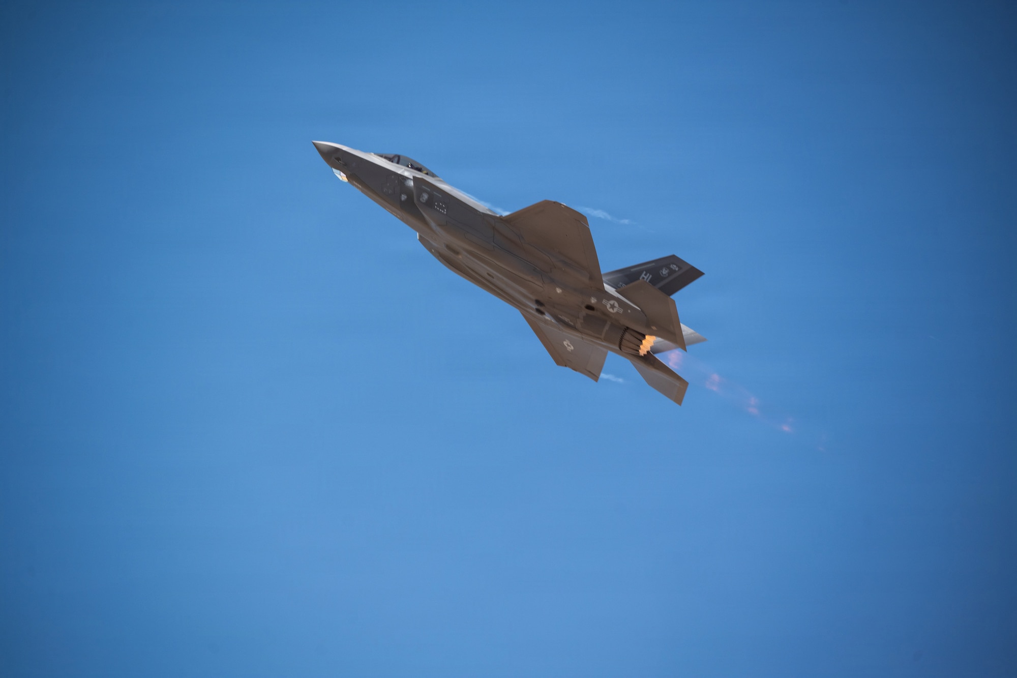 An F-35A Lighting II performs maneuvers.