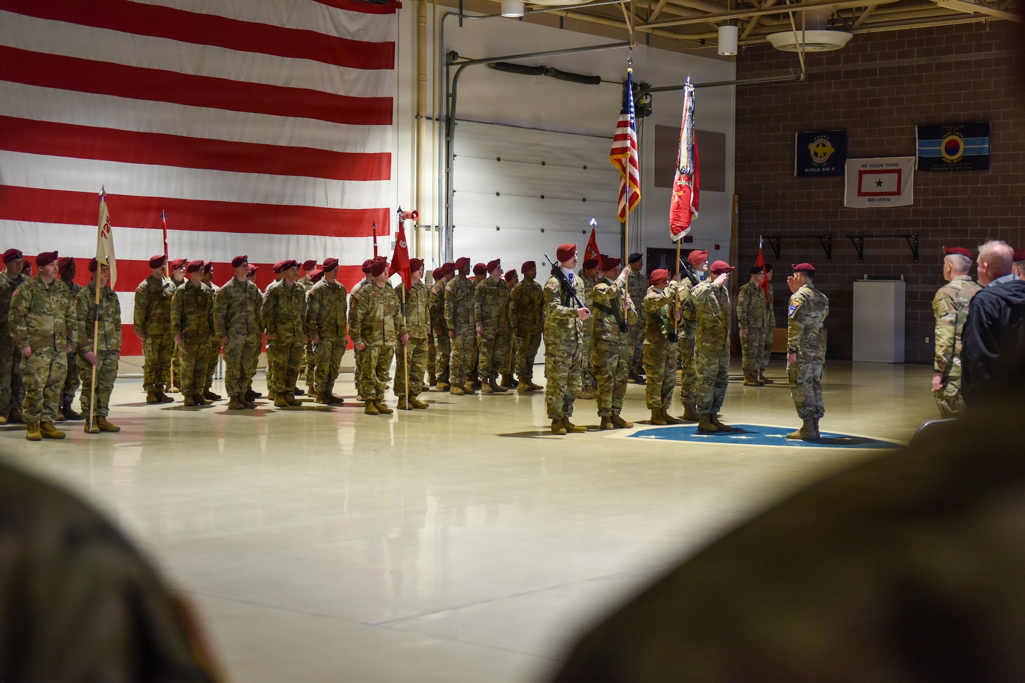 U.S. Army Soldiers assigned to 6th Brigade Engineer Battalion, 2nd Infantry Brigade Combat Team (Airborne), 11th Airborne Division, stand at the position of attention during a reflagging ceremony at the Alaska National Guard Armory, April 17, 2026, on Joint Base Elmendorf-Richardson, Alaska. The 6th BEB officially reflagged as the 6th Division Engineer Battalion, marking a significant step in transforming and strengthening the 11th Airborne Division mission in the arctic and Indo-Pacific. (U.S. Air Force photo by Nicholas Holland)