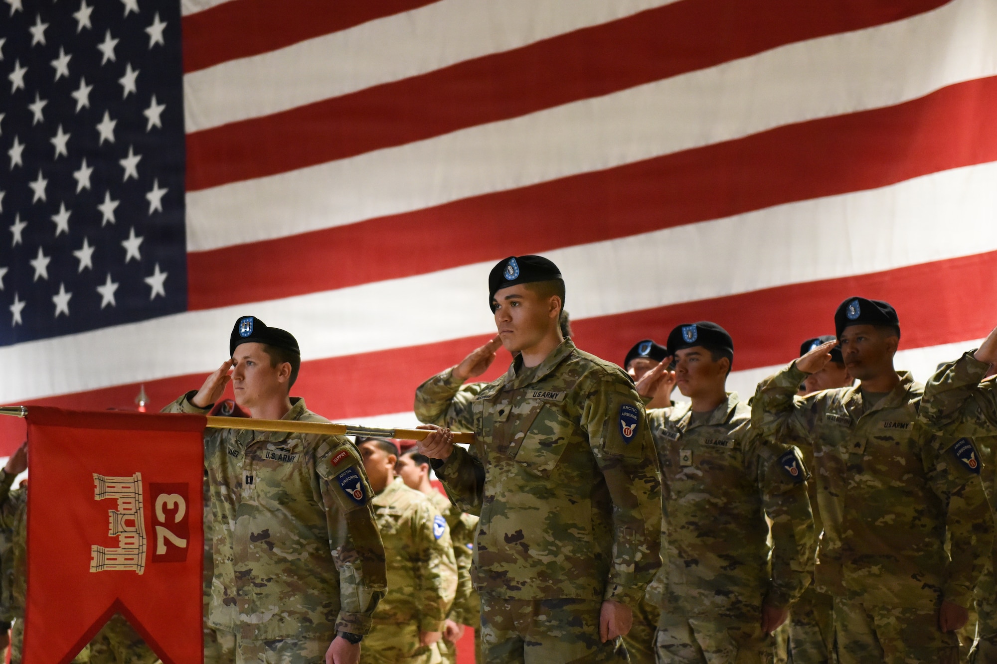 U.S. Army Soldiers assigned to 6th Brigade Engineer Battalion, 2nd Infantry Brigade Combat Team (Airborne), 11th Airborne Division, salute in formation during a reflagging ceremony at the Alaska National Guard Armory, April 17, 2026, on Joint Base Elmendorf-Richardson, Alaska. The 6th BEB officially reflagged as the 6th Division Engineer Battalion, marking a significant step in transforming and strengthening the 11th Airborne Division mission in the arctic and Indo-Pacific. (U.S. Air Force photo by Nicholas Holland)