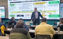 DAHLGREN, Va. – Professor C.A. "K-Jack" Krajacich, director of Maritime Staff Courses at the U.S. Naval War College, teaches the first Naval Surface Warfare Center Dahlgren Division (NSWCDD) Wartime Readiness Short Course to a room full of Sailors and civilians. The course is designed to provide perspective on how maritime operations centers support the fleet. (Matt Lyman/NSWCDD Photo)
