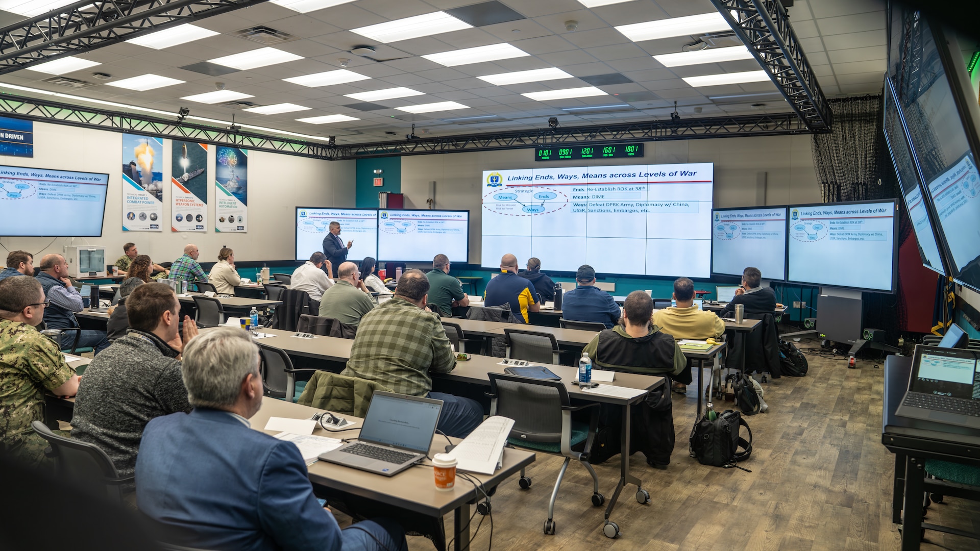 DAHLGREN, Va. – Professor C.A. "K-Jack" Krajacich, director of Maritime Staff Courses at the U.S. Naval War College, teaches the first Naval Surface Warfare Center Dahlgren Division (NSWCDD) Wartime Readiness Short Course to a room full of Sailors and civilians. The course is designed to provide perspective on how maritime operations centers support the Fleet. (Matt Lyman/NSWCDD Photo)
