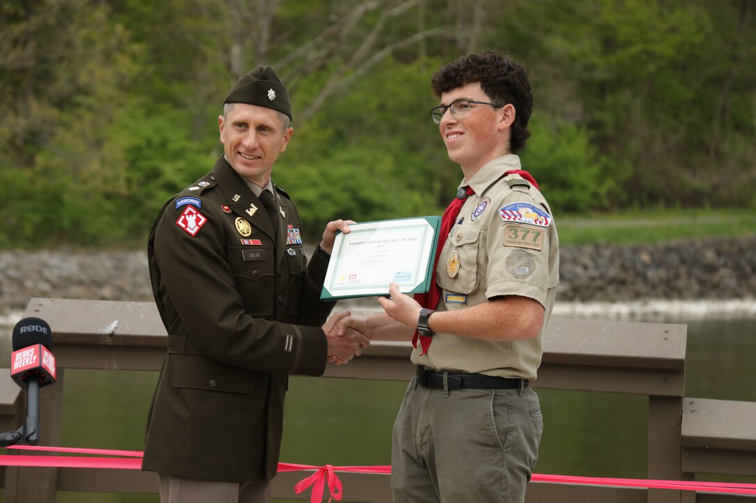 U.S. Army Corps of Engineers Philadelphia District Commander Lt. Col. Ryan A. Baum presents Life Scout Gavin Wanner with a Volunteer Excellence Award in recognition of his Eagle Scout project.