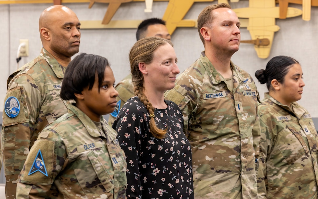 Attendees stand for the official party’s arrival to the 593rd Test and Evaluation Squadron, Space Delta 12, activation ceremony April 20, 2026, at Edwards Air Force Base, California. The unit’s activation formalizes a mission that has grown through the Space Force’s partnership with the U.S. Air Force Test Pilot School at Edwards AFB. (U.S. Air Force photo by Daniel Kelley, 412th Test Wing Public Affairs)