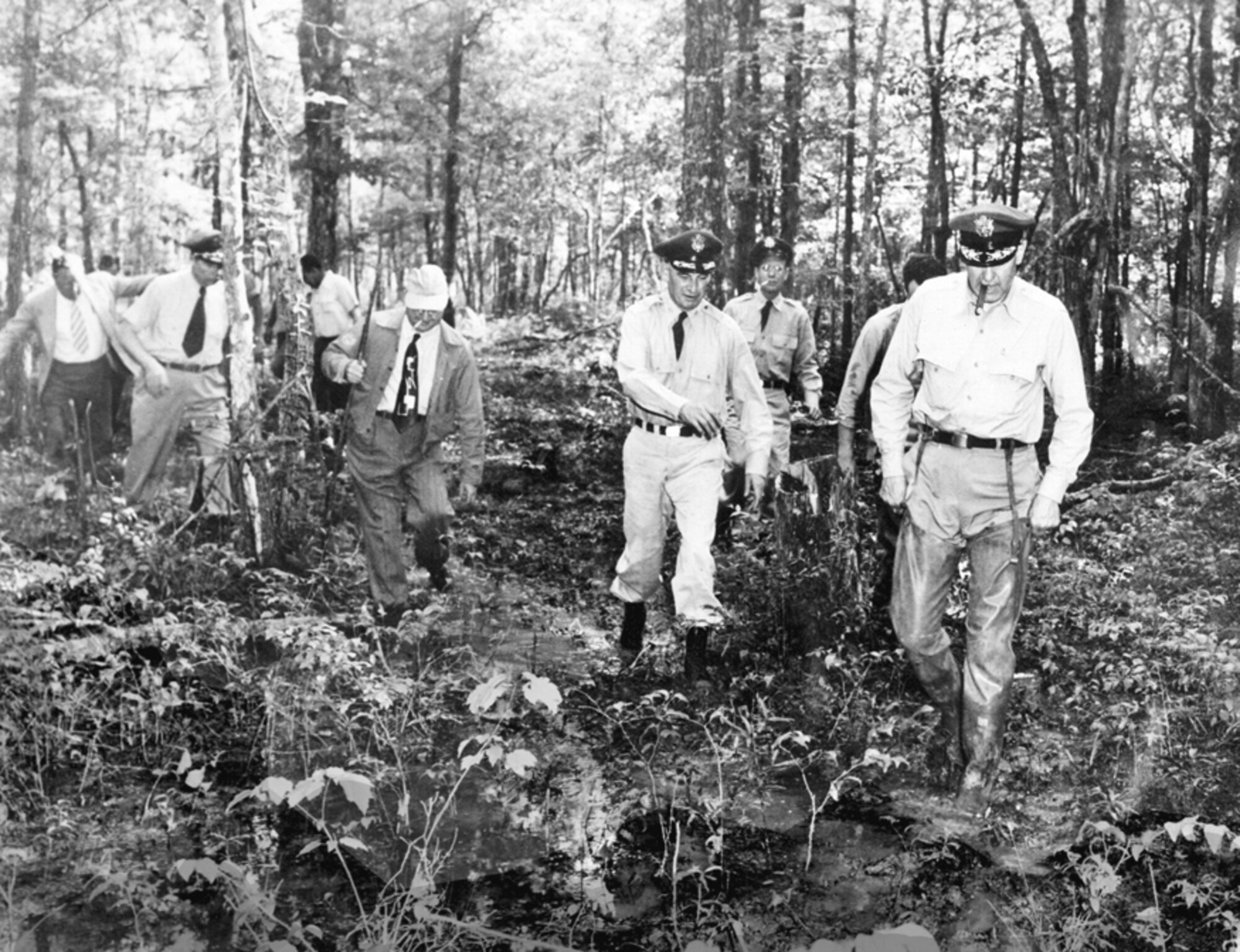 Maj. Gen. Franklin O. Carroll, first commander of the Arnold Engineering Development Center, right, is joined by Col. Lebbeus Woods, Deputy Chief of Staff of AEDC Materiel, center, in inspecting the AEDC site prior to facility construction in the early 1950s. Woods Reservoir was dedicated in memory of Woods in July 1953. Woods, who was assigned to AEDC from January 1950 to February 1952, passed away in May 1953. (U.S. Air Force photo)