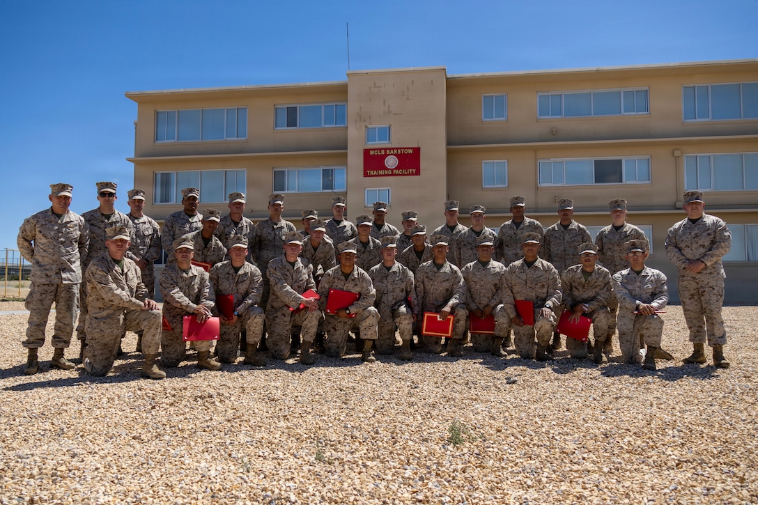 Colonel Russell Savatt, base commanding officer, and Sergeant Major Mario Virto, base sergeant major, recognized twenty-five Marines of the Communication Training Battalion of MAGTF Training Command/Marine Corps Air Ground Combat Center at 29 Palms that supported and participated throughout Semper Durus 2026 aboard Marine Corps Logistics Base Barstow, California, April 23. Staff Sergeant Dylan Alvarado was commended for his exemplary leadership and awarded directly by command.