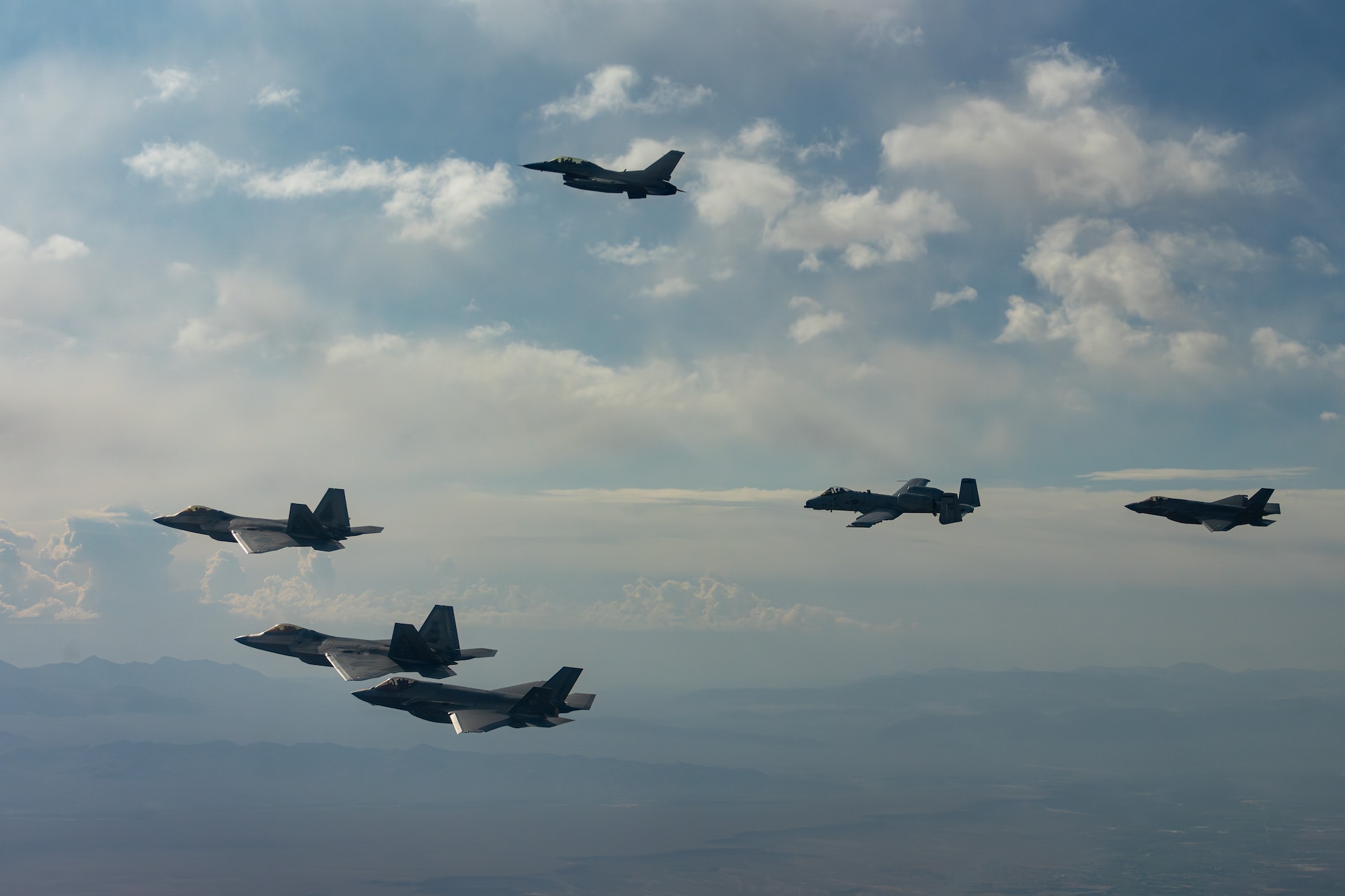 Five fighter jets flying in unison.