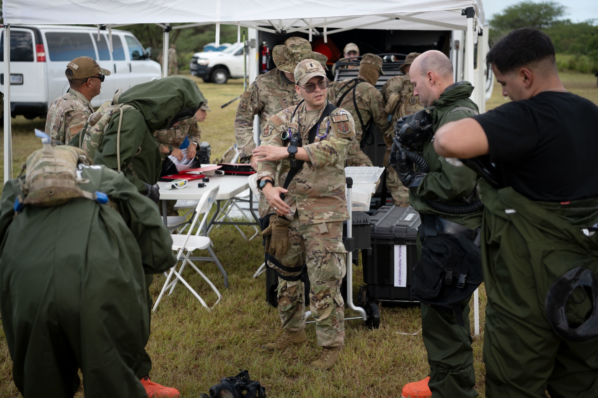 U.S. Airmen and Soldiers assigned to the 22nd CBRN Enhanced Response Force Package, Puerto Rico National Guard, prepare to receive medical triage during a Synchronization Collective Training exercise at Camp Santiago Joint Training Center, Salinas, Puerto Rico, March 12, 2026. The exercise immersed teams in high-stress disaster simulations involving search and extraction, decontamination, and medical triage focused on ensuring readiness during domestic operations and future evaluations. (U.S. Air National Guard photo by Master Sgt. Rafael Rosa)