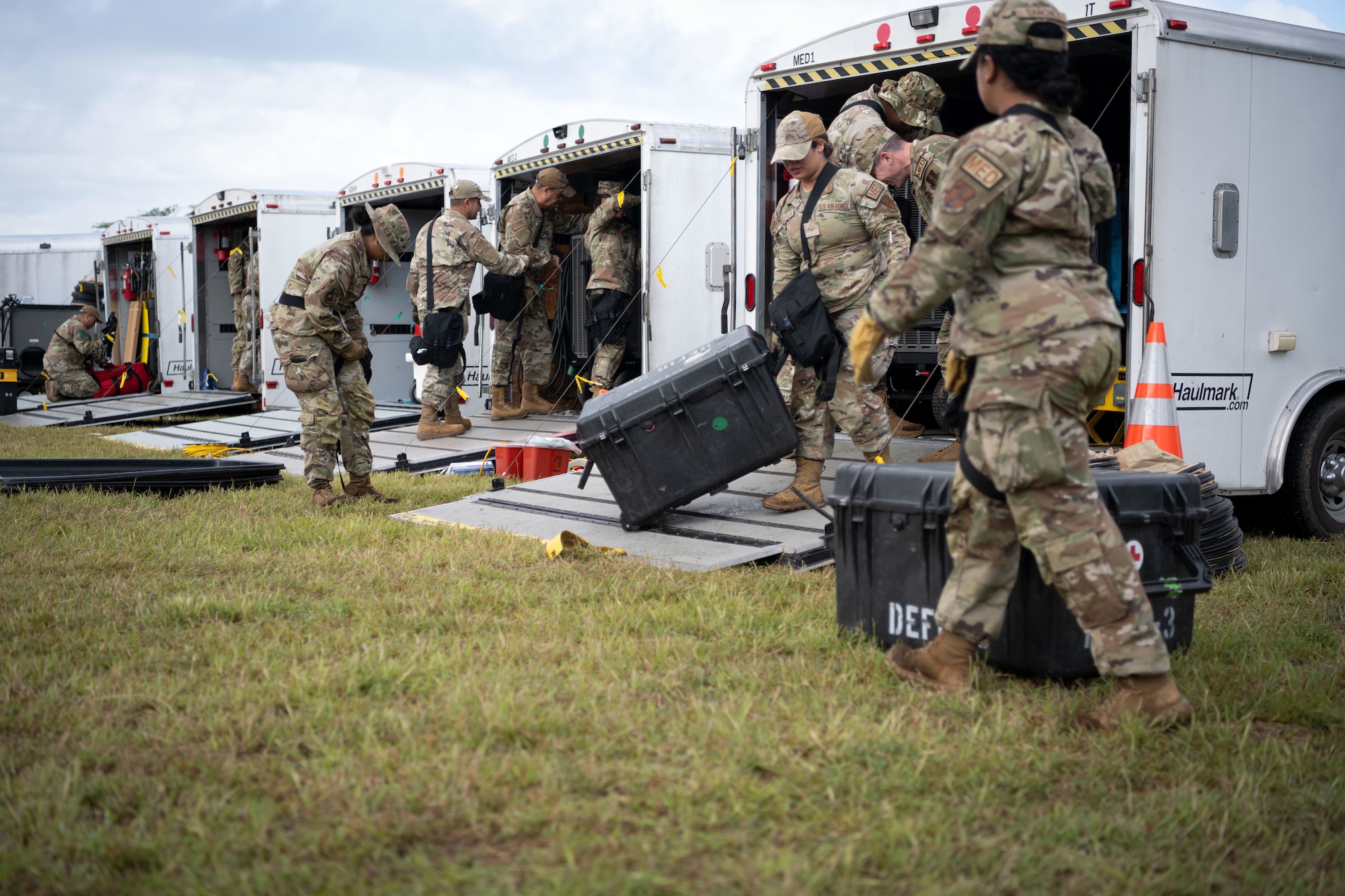 U.S. Airmen assigned to the 22nd CBRN Enhanced Response Force Package, Puerto Rico National Guard, establish a temporary disaster response base during a Synchronization Collective Training exercise at Camp Santiago Joint Training Center, Salinas, Puerto Rico, March 12, 2026. The exercise immersed teams in high-stress disaster simulations involving search and extraction, decontamination, and medical triage focused on ensuring readiness during domestic operations and future evaluations. (U.S. Air National Guard photo by Master Sgt. Rafael Rosa)
