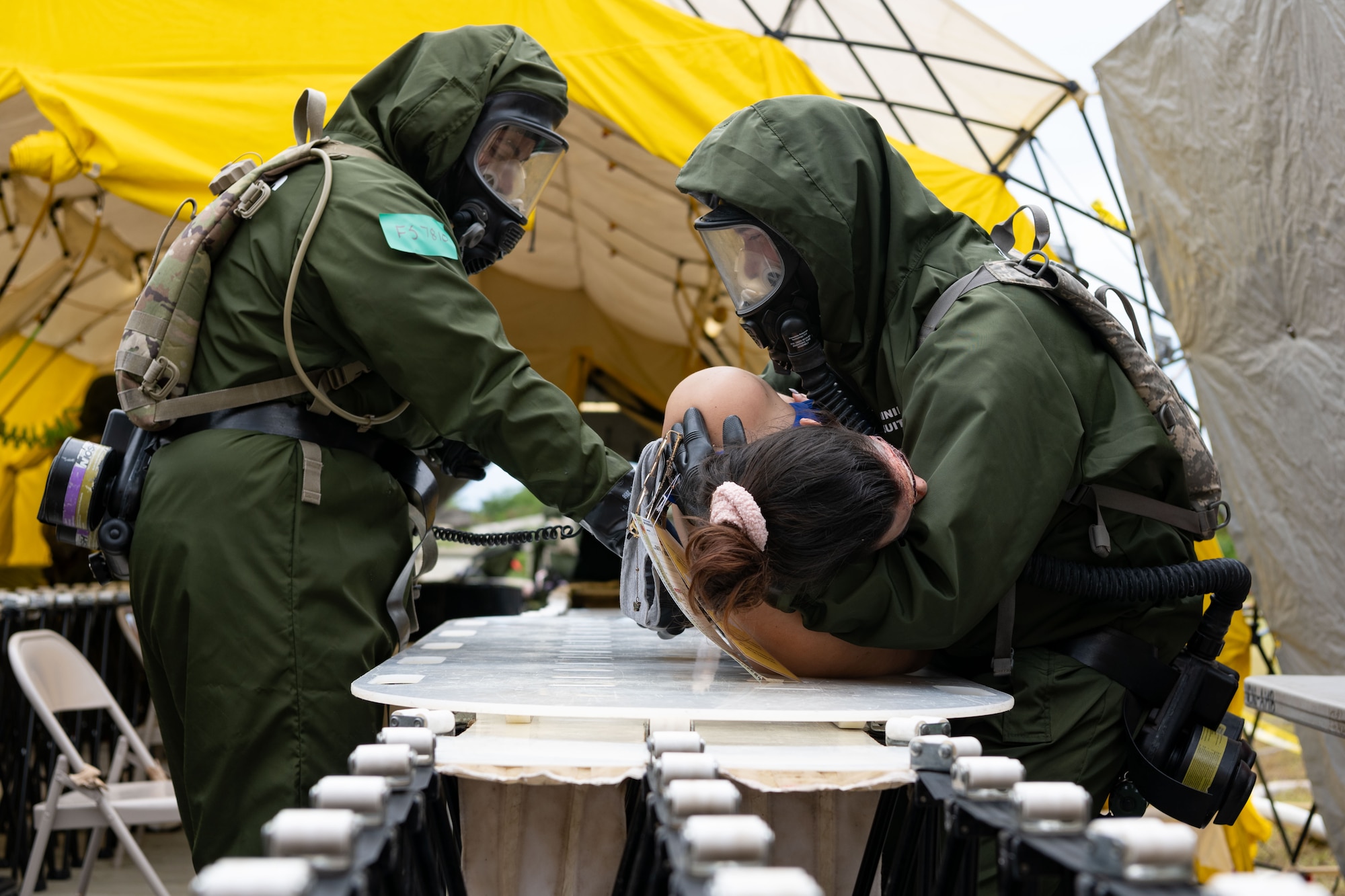 U.S. Soldiers assigned to the 22nd CBRN Enhanced Response Force Package, Puerto Rico National Guard, scan a simulated victim for Chemical, Biological, Radiological and Nuclear agents during a Synchronization Collective Training exercise at Camp Santiago Joint Training Center, Salinas, Puerto Rico, March 12, 2026. The exercise immersed teams in high-stress disaster simulations involving search and extraction, decontamination, and medical triage focused on ensuring readiness during domestic operations and future evaluations. (U.S. Air National Guard photo by Master Sgt. Victor Vazquez)