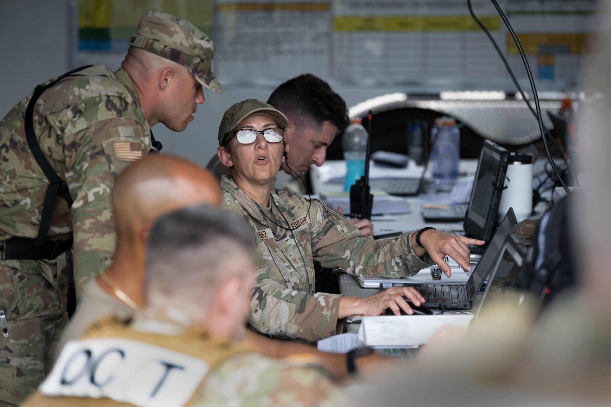 U.S. Airmen and Soldiers assigned to the 22nd CBRN Enhanced Response Force Package, Puerto Rico National Guard, operate the command center during a Synchronization Collective Training exercise at Camp Santiago Joint Training Center, Salinas, Puerto Rico, March 12, 2026. The exercise immersed teams in high-stress disaster simulations involving search and extraction, decontamination, and medical triage focused on ensuring readiness during domestic operations and future evaluations. (U.S. Air National Guard photo by Master Sgt. Rafael Rosa)