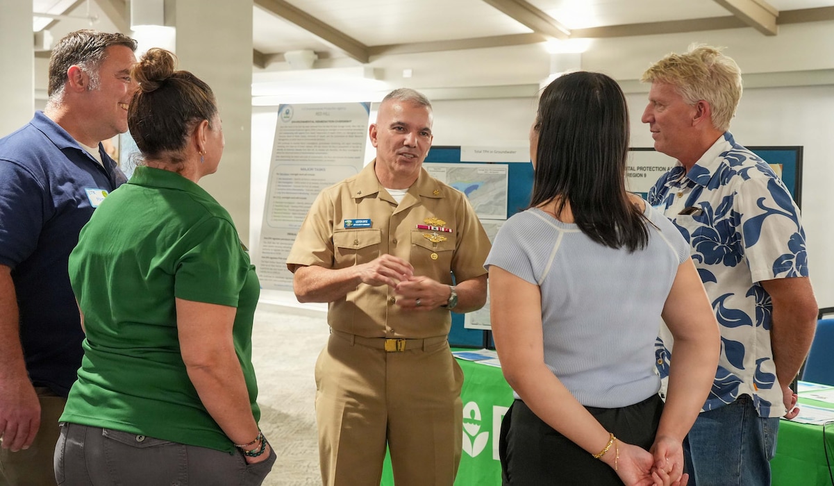 Rear Adm. Lester Ortiz, deputy commander of Navy Closure Task Force-Red Hill (NCTF-RH), speaks with representatives from the Environmental Protection Agency during the NCTF-RH open house, held at the Pearl at Kalauao in Honolulu, April 15, 2026. The open house focused on current and future efforts of NCTF-RH and provided community members with opportunities to speak one-on-one with subject matter experts who are actively involved in the Red Hill Bulk Fuel Storage Facility (RHBFSF) decommissioning and the Navy’s ongoing environmental efforts. Charged with the safe decommissioning of the facility, NCTF-RH was established by the Department of the Navy as a commitment to the community and the environment. The Navy continues to engage with the people of Hawaii, regulatory agencies, and other stakeholders as NCTF-RH works to safely and deliberately decommission the RHBFSF. (U.S. Navy photo by Mass Communication Specialist 1st Class Glenn Slaughter)