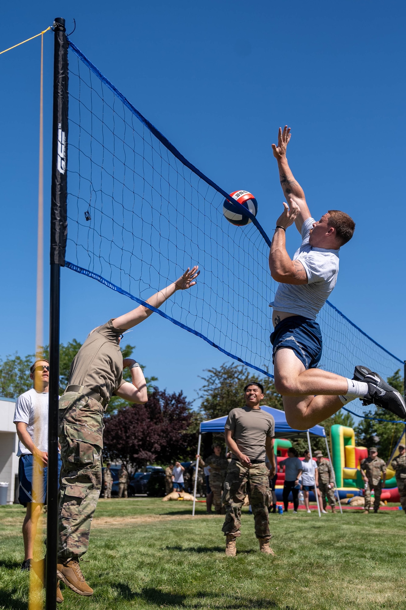 Airmen playing volleyball.