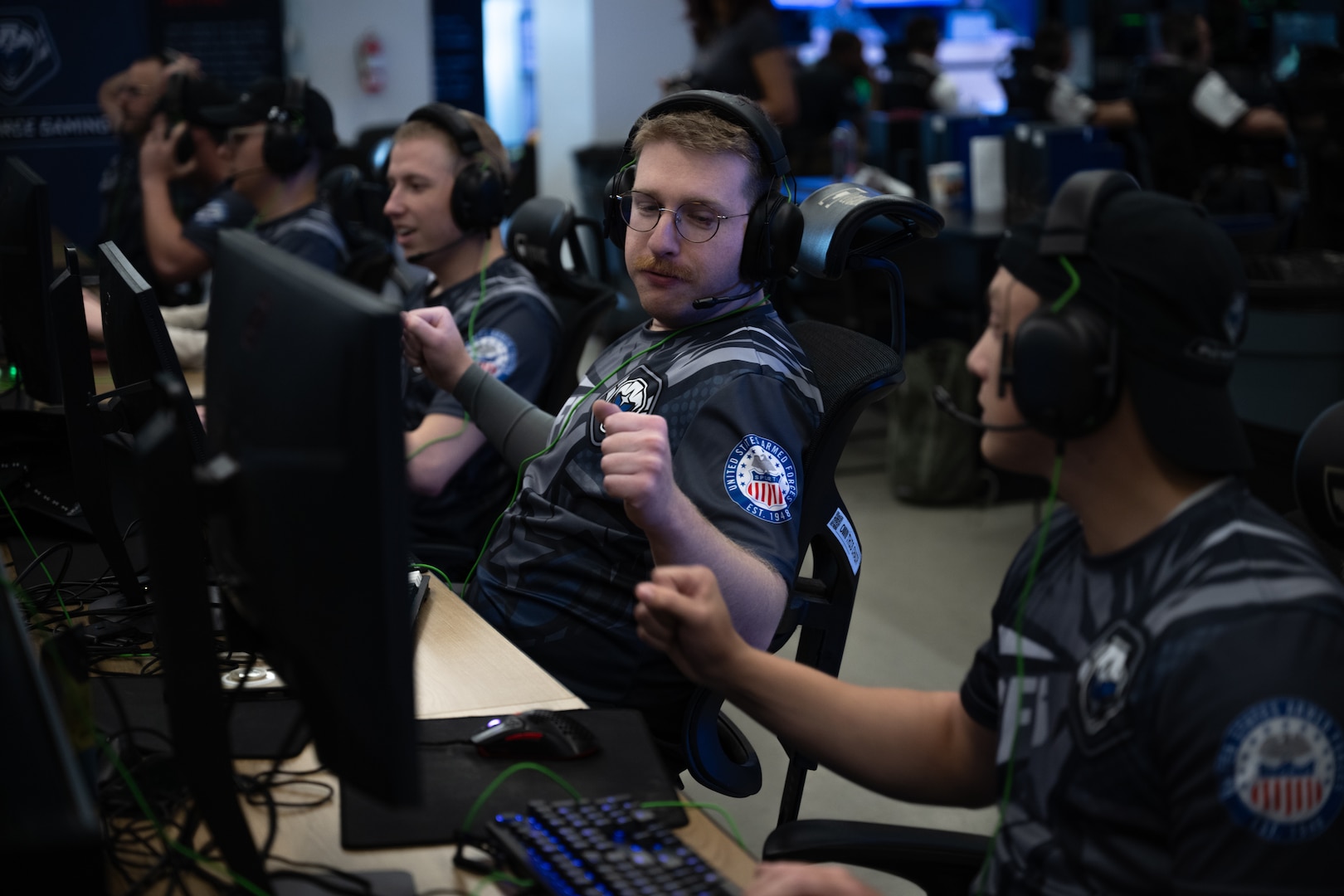 U.S. guardians celebrate a win after a match during the 2026 Armed Forces Esports Championship at Localhost in Philadelphia, Pennsylvania, April 24, 2026. Service members competed in organized esports competition playing Marvel Rivals for championship honors while representing their respective services. Armed Forces Sports brings together service members from the Army, Marine Corps, Navy, Coast Guard, and Air Force, and Space Force to compete at the national level. Armed Forces Sports promotes physical fitness, cognitive readiness, teamwork, and competitive opportunities for military members while supporting recruitment and retention efforts and strengthening partnerships through emerging sports platforms. (DoW photo by U.S. Marine Corps Sgt. Kayla Halloran)