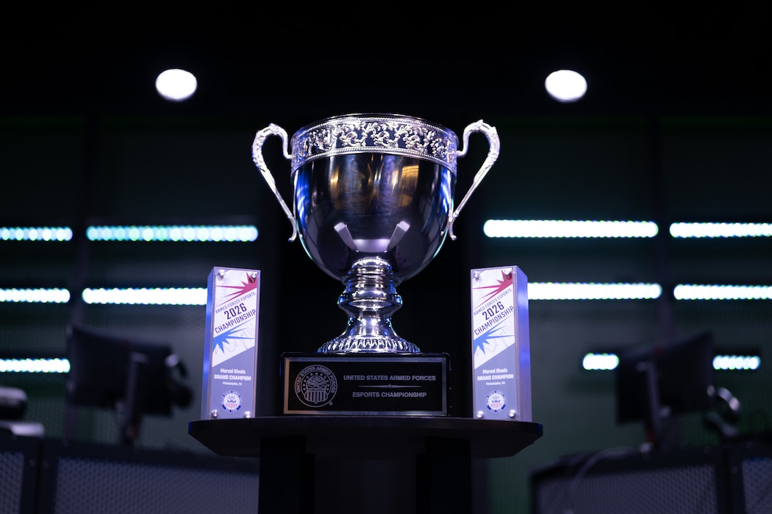 The championship trophy is displayed on stage before the 2026 Armed Forces Esports Championship at Localhost in Philadelphia, Pennsylvania, April 23, 2026. Service members competed in organized esports competition playing Marvel Rivals for championship honors while representing their respective services. Armed Forces Sports brings together service members from the Army, Marine Corps, Navy, Coast Guard, Air Force, and Space Force to compete at the national level. Armed Forces Sports promotes physical fitness, cognitive readiness, teamwork, and competitive opportunities for military members while supporting recruitment and retention efforts and strengthening partnerships through emerging sports platforms. (U.S. Armed Forces Sports photo by U.S. Marine Corps Sgt. Kayla Halloran)