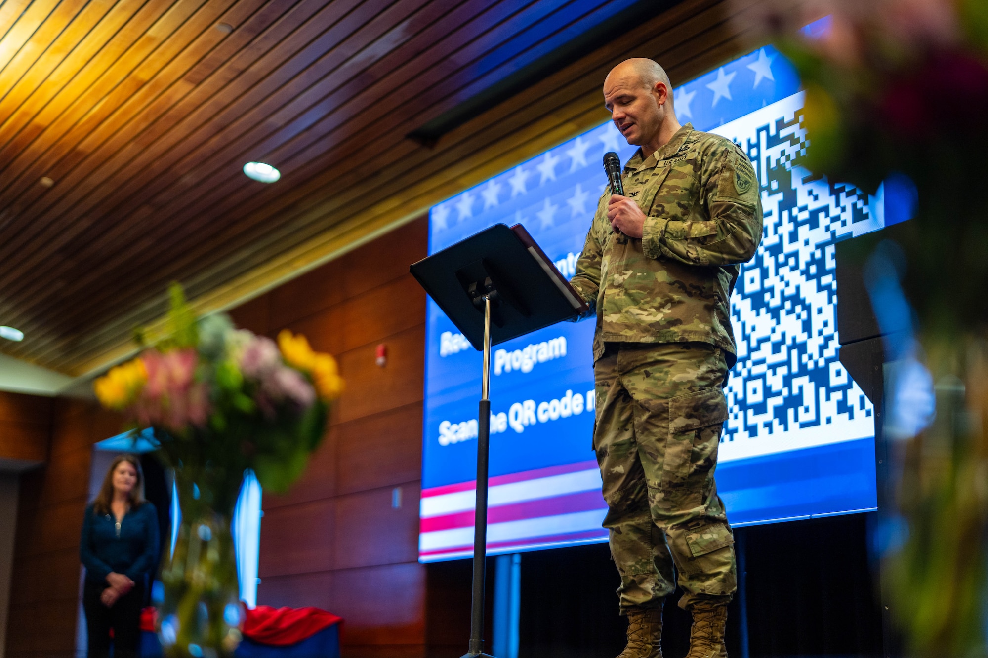 U.S. Army Jimmy Howell, 2nd Airborne Brigade Combat Team, 11th Infantry Division commander delivers remarks during the Annual Volunteer Recognition Ceremony at Joint Base Elmendorf-Richardson, Alaska, April 22, 2026. The event honored service members, families, civilians and community partners whose volunteer efforts support readiness, strengthen ties with the Anchorage community and contribute more than a million dollars in estimated in-kind value each year. (U.S. Air Force photo by Airman 1st Class Keola Vischi)