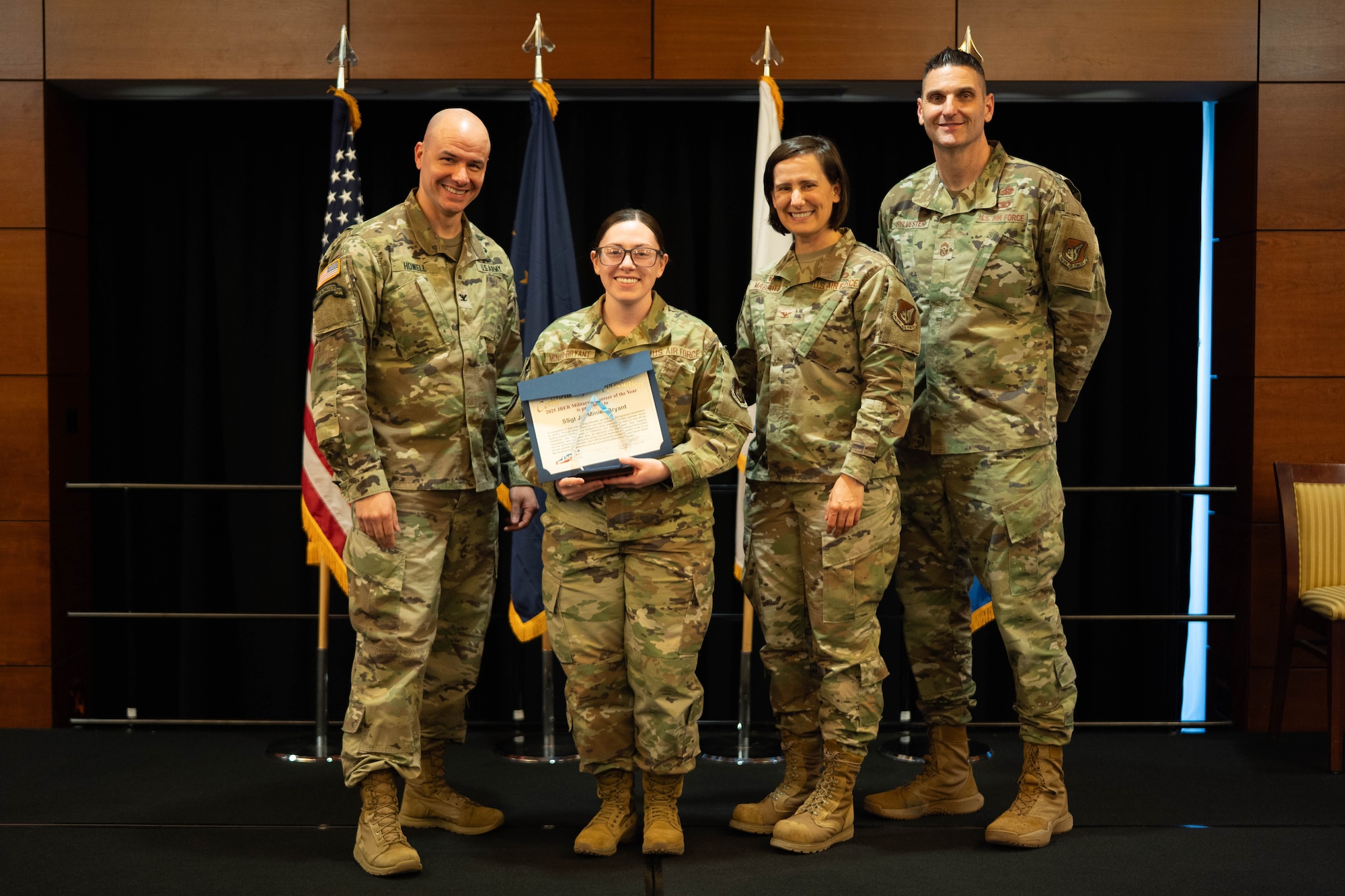 U.S. Air Force Staff Sgt. Joi Minier-Bryant, 673d Medical Group logistician specializing in contract management, stands for a photo after receiving the 2025 Military Volunteer of the Year Award on Joint Base Elmendorf-Richardson, Alaska, April 22, 2025. Minier-Bryant has volunteered since high school and now serves her community through efforts such as teaching children’s ministry at a local church, where she supports military children, helps them cope with deployments and strengthens military families through faith-based mentorship. (U.S. Air Force photo by Airman 1st Class Keola Vischi)