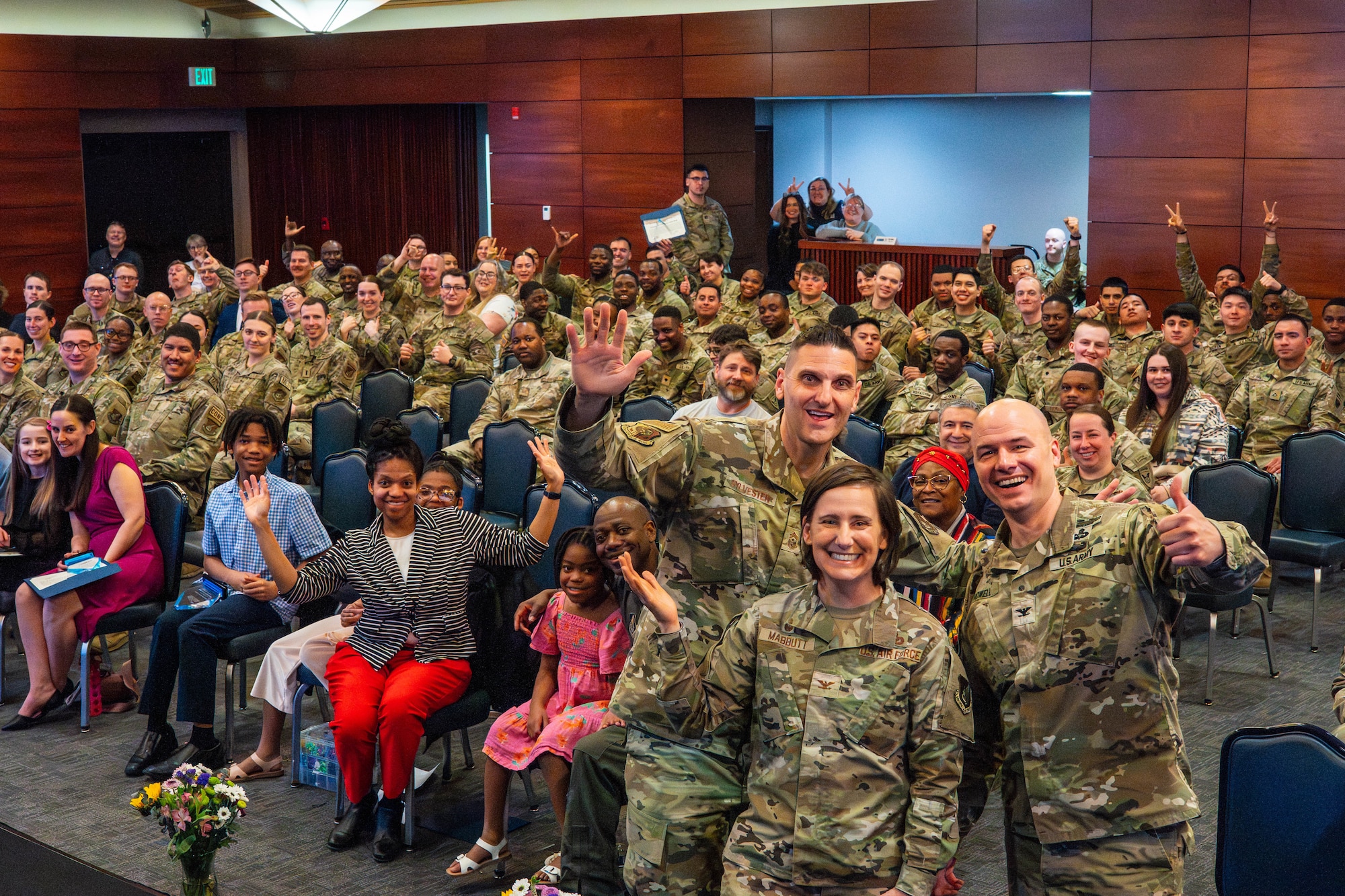 Joint Base Elmendorf-Richardson leadership takes a photo with nominees at the Annual Volunteer Recognition Ceremony on JBER, Alaska, April 22, 2026. The ceremony recognized service members, Airmen, Soldiers, families, civilians, retirees and community partners who volunteered both on and off base and showcased the total recorded volunteer hours and in-kind dollar value, which exceeded $1.5 million in contribution for the year of 2025. (U.S. Air Force photo by Airman 1st Class Keola Vischi)