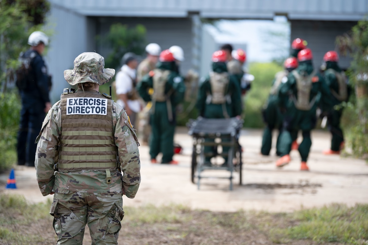 U.S. Airmen and Soldiers assigned to the 22nd CBRN Enhanced Response Force Package, Puerto Rico National Guard, conduct search and rescue operations during a Synchronization Collective Training exercise at Camp Santiago Joint Training Center, Salinas, Puerto Rico, March 12, 2026. The exercise immersed teams in high-stress disaster simulations involving search and extraction, decontamination, and medical triage focused on ensuring readiness during domestic operations and future evaluations. (U.S. Air National Guard photo by Master Sgt. Rafael Rosa)