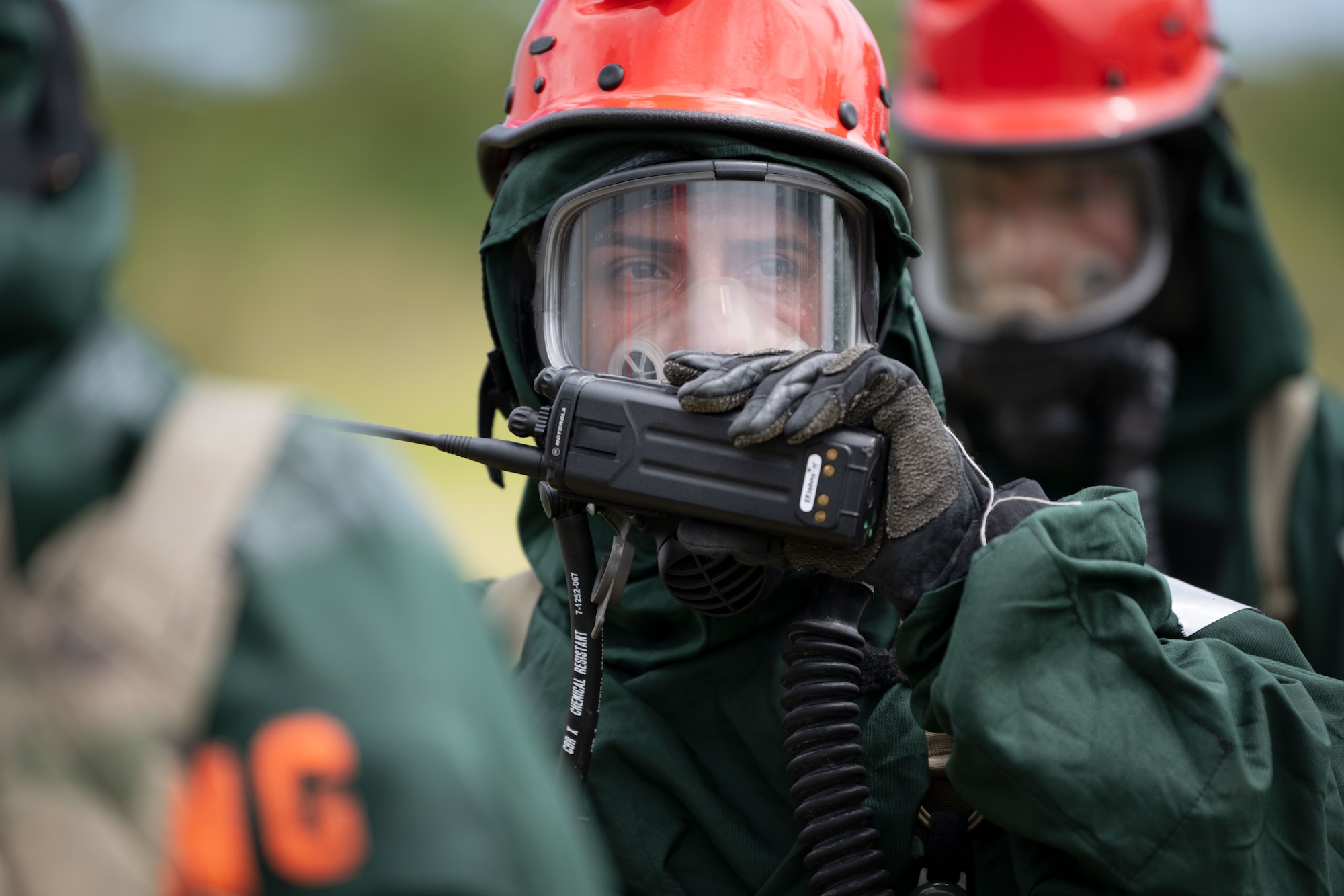A U.S. Soldier assigned to the 22nd CBRN Enhanced Response Force Package, Puerto Rico National Guard, communicates via radio during a Synchronization Collective Training exercise at Camp Santiago Joint Training Center, Salinas, Puerto Rico, March 12, 2026. The exercise immersed teams in high-stress disaster simulations involving search and extraction, decontamination, and medical triage focused on ensuring readiness during domestic operations and future evaluations. (U.S. Air National Guard photo by Master Sgt. Rafael Rosa)
