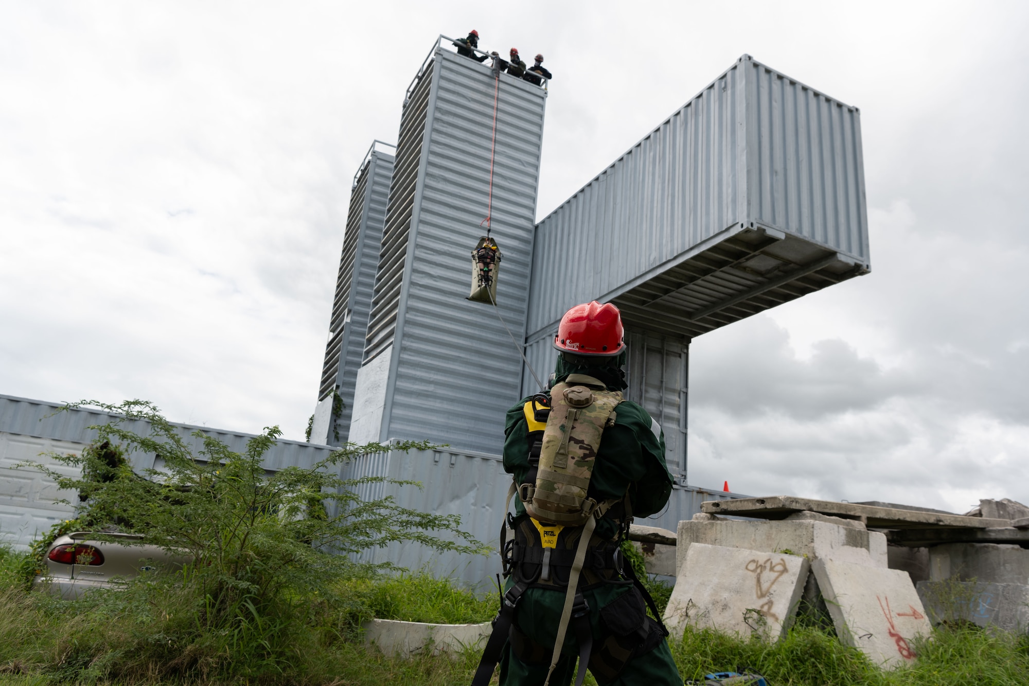 U.S. Soldiers assigned to the 22nd CBRN Enhanced Response Force Package, Puerto Rico National Guard, conduct rescue operations to a simulated victim during a Synchronization Collective Training exercise at Camp Santiago Joint Training Center, Salinas, Puerto Rico, March 12, 2026. The exercise immersed teams in high-stress disaster simulations involving search and extraction, decontamination, and medical triage focused on ensuring readiness during domestic operations and future evaluations. (U.S. Air National Guard photo by Master Sgt. Victor Vazquez)