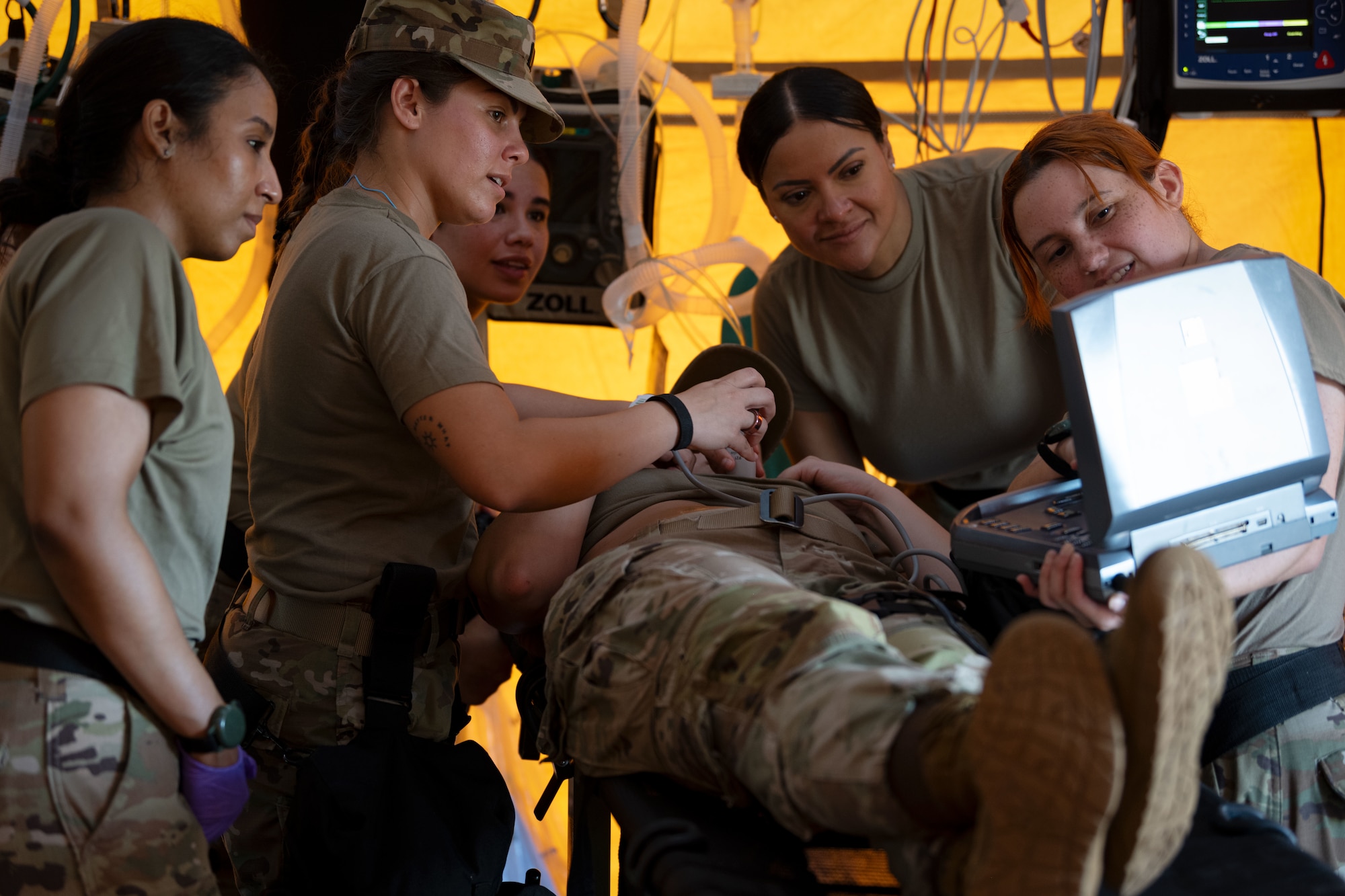 U.S. Airmen and Soldiers assigned to the 22nd CBRN Enhanced Response Force Package, Puerto Rico National Guard, operate a portable ultra sound machine during a Synchronization Collective Training exercise at Camp Santiago Joint Training Center, Salinas, Puerto Rico, March 12, 2026. The exercise immersed teams in high-stress disaster simulations involving search and extraction, decontamination, and medical triage focused on ensuring readiness during domestic operations and future evaluations. (U.S. Air National Guard photo by Master Sgt. Rafael Rosa)