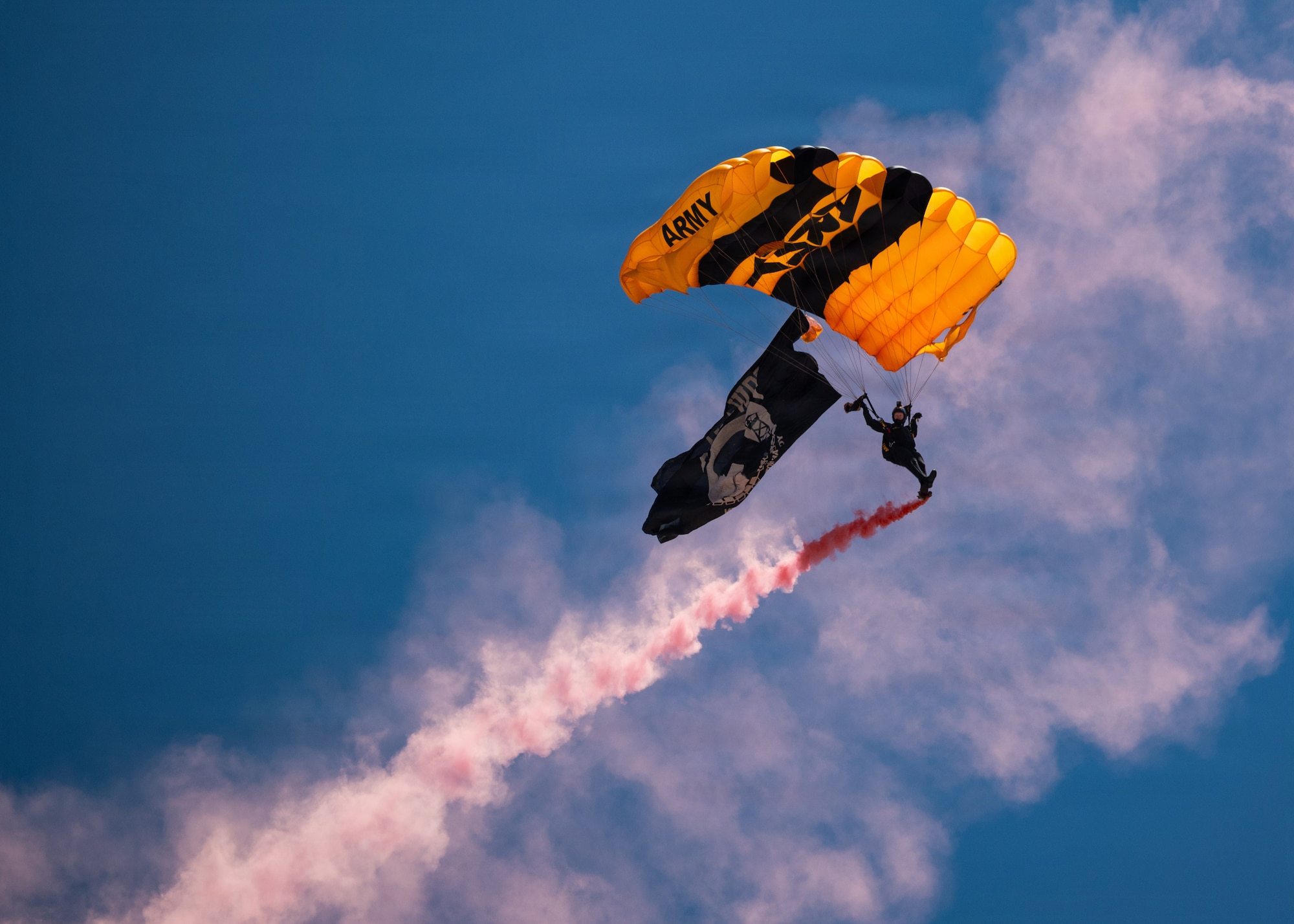 A member of the U.S. Army Golden Knights Parachute Team glides to the ground.