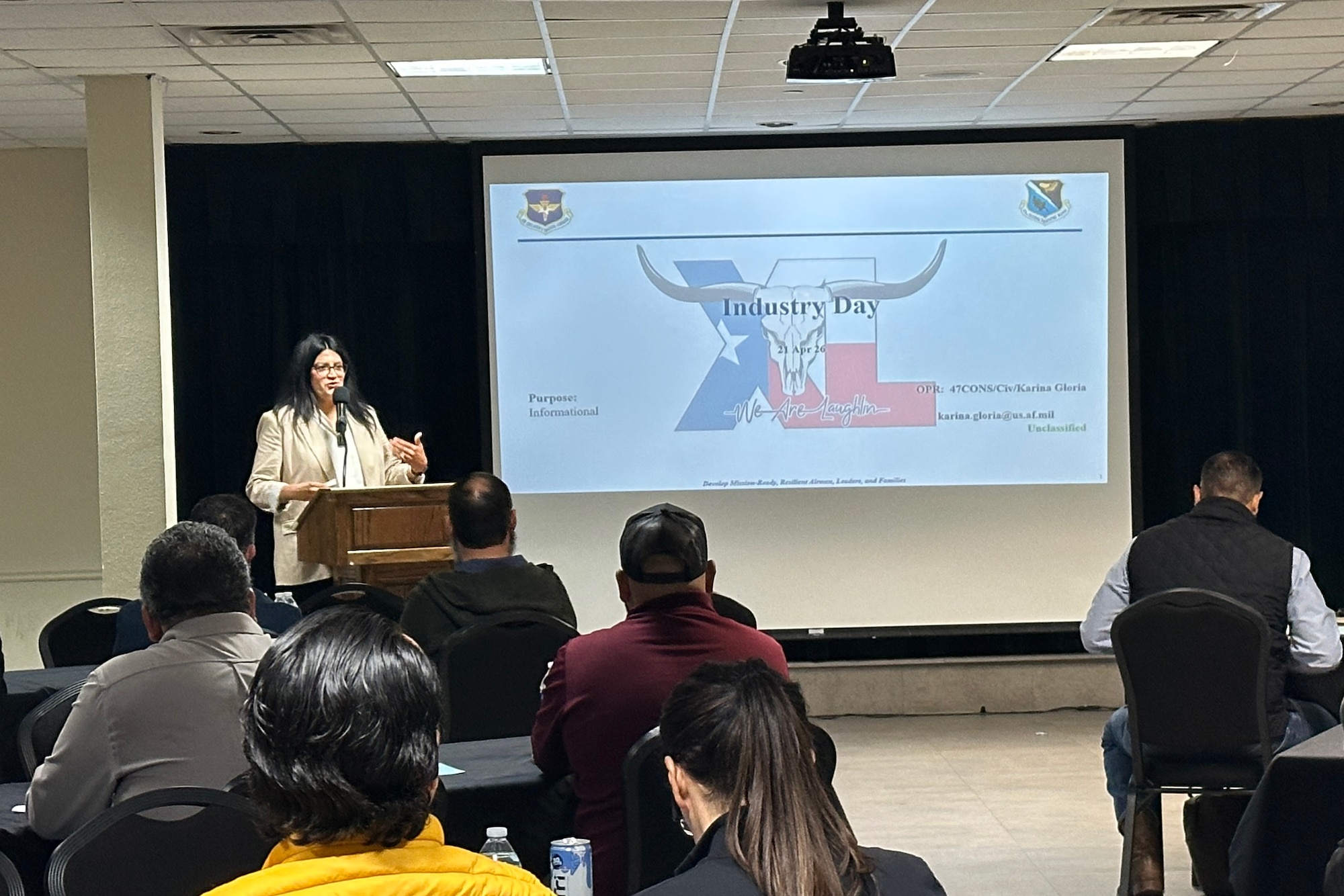 Karina Gloria, 47th Contracting Squadron contracting specialist, provides opening remarks for Industry Day to businesspeople at Laughlin Air Force Base, Texas, April 21, 2026. The goals of the 47th CONS Industry Day were to connect with local contractors, reduce procurement lead time, show upcoming opportunities, and increase overall competition. (U.S. Air Force photo by Capt. Christine Del Aguila)