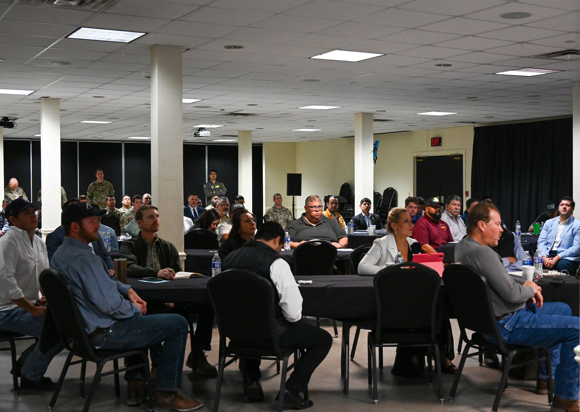Businesspeople listen to an Industry Day briefing at Laughlin Air Force Base, Texas, April 21, 2026. The goals of the 47th Contracting Squadron Industry Day were to connect with local contractors, reduce procurement lead time, show upcoming opportunities, and increase overall competition. (U.S. Air Force photo by Airman 1st Class Kylie Rabb)