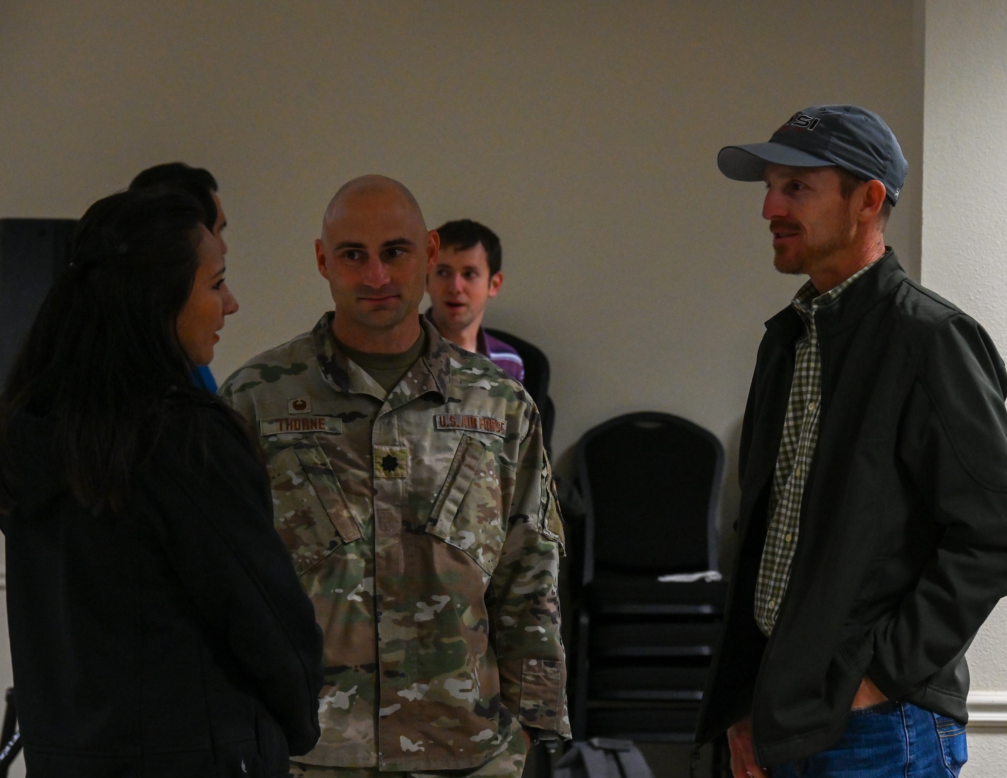 U.S Air Force Lt. Col. Matthew Thorne, 47th Contracting Squadron commander, converses with businesspeople at Laughlin Air Force Base, Texas, April 21, 2026. Industry Day, hosted in partnership with organizations like the Northwest Texas APEX Accelerator, serves as a critical bridge between the Department of War's operational needs and the dynamic capabilities of the private sector. (U.S. Air Force photo by Airman 1st Class Kylie Rabb)