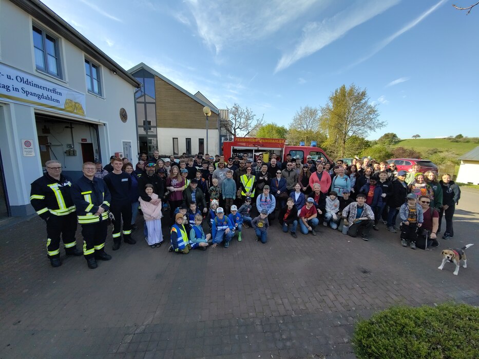 Volunteers gather for a group photo at the Spangdahlem volunteer fire department before the start of the annual Spangerbach creek cleanup in Spangdahlem, Germany, April 25, 2026. The event drew the largest turnout in its 27-year history, bringing together German residents and U.S. service members to remove debris from waterways surrounding the village. (U.S. Air Force photo by Master Sgt. Alexander W. Riedel)