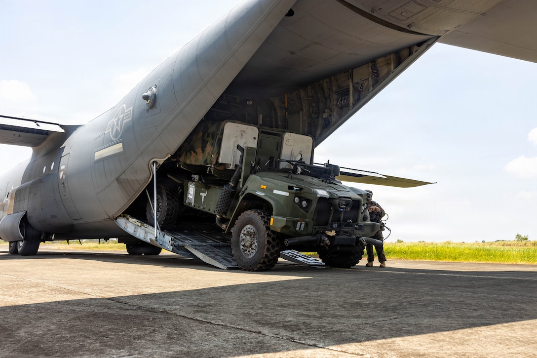 U.S. Marines with 3rd Littoral Combat Team, 3rd Marine Littoral Regiment, 3rd Marine Division, load a Navy-Marine Expeditionary Ship Interdiction System onto a U.S. Air Force C-130J Super Hercules aircraft assigned to 733rd Air Mobility Squadron during Exercise Balikatan 2026 at Cagayan North International Airport, Lal-lo, Philippines, April 25, 2026.