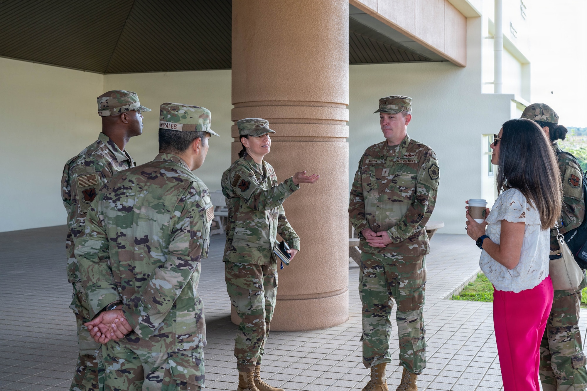 Service members greet each other before tour.