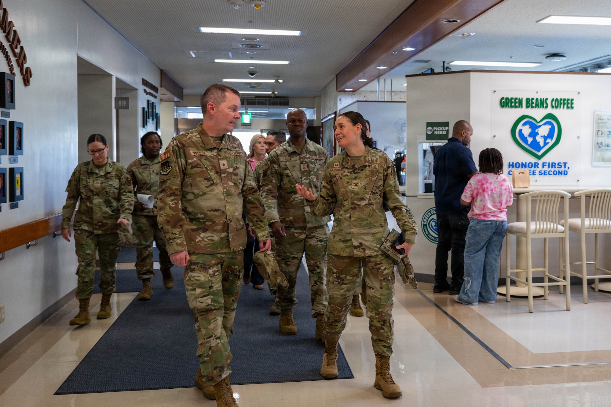 Service members speak with each other.