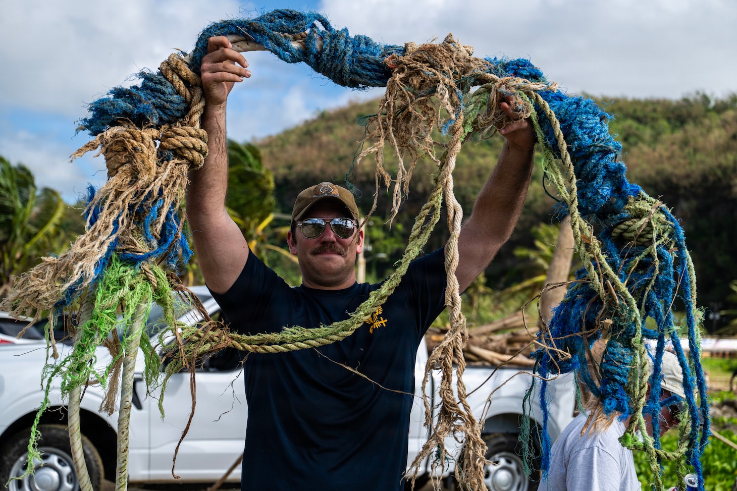 Machinists Mate (Nuclear) 1st Class Brandon Anderson, assigned to the Performance Monitoring Team Guam at Commander, Submarine Squadron 15 (CSS-15), participates in a beach cleanup following Super Typhoon Sinlaku. CSS-15 and other military commands across Guam are providing vital support to villages and civil authorities, strengthening crisis response and recovery efforts in the wake of Super Typhoon Sinlaku. (U.S. Navy photo by Mass Communication Specialist 1st Class Bryan Mai)