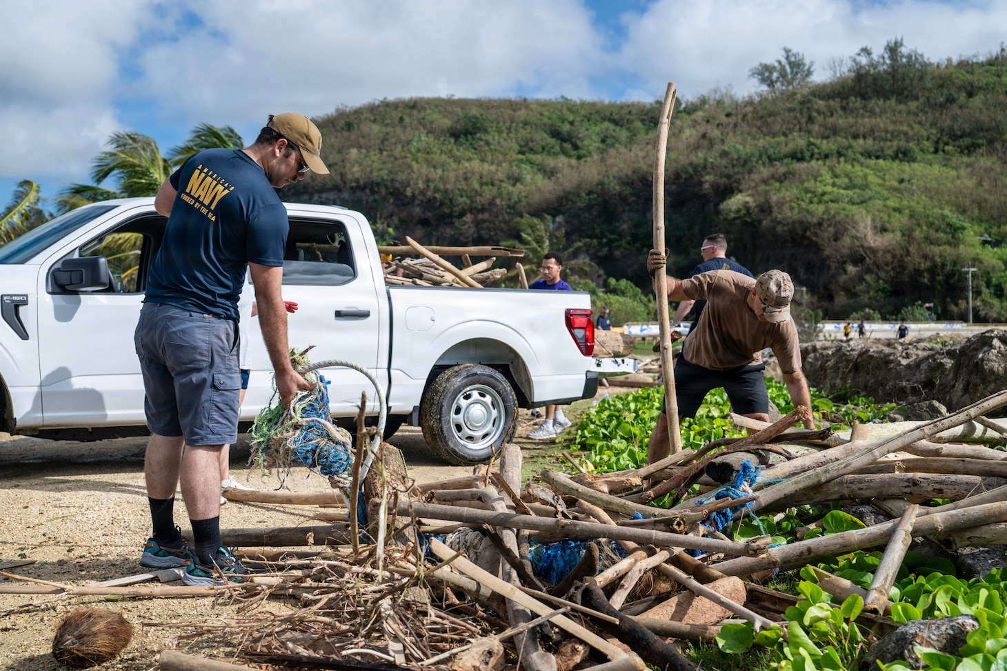 Sailors assigned to Commander, Submarine Squadron 15 (CSS-15), participate in a beach cleanup following Super Typhoon Sinlaku. CSS-15 and other military commands across Guam are providing vital support to villages and civil authorities, strengthening crisis response and recovery efforts in the wake of Super Typhoon Sinlaku. (U.S. Navy photo by Mass Communication Specialist 1st Class Bryan Mai)