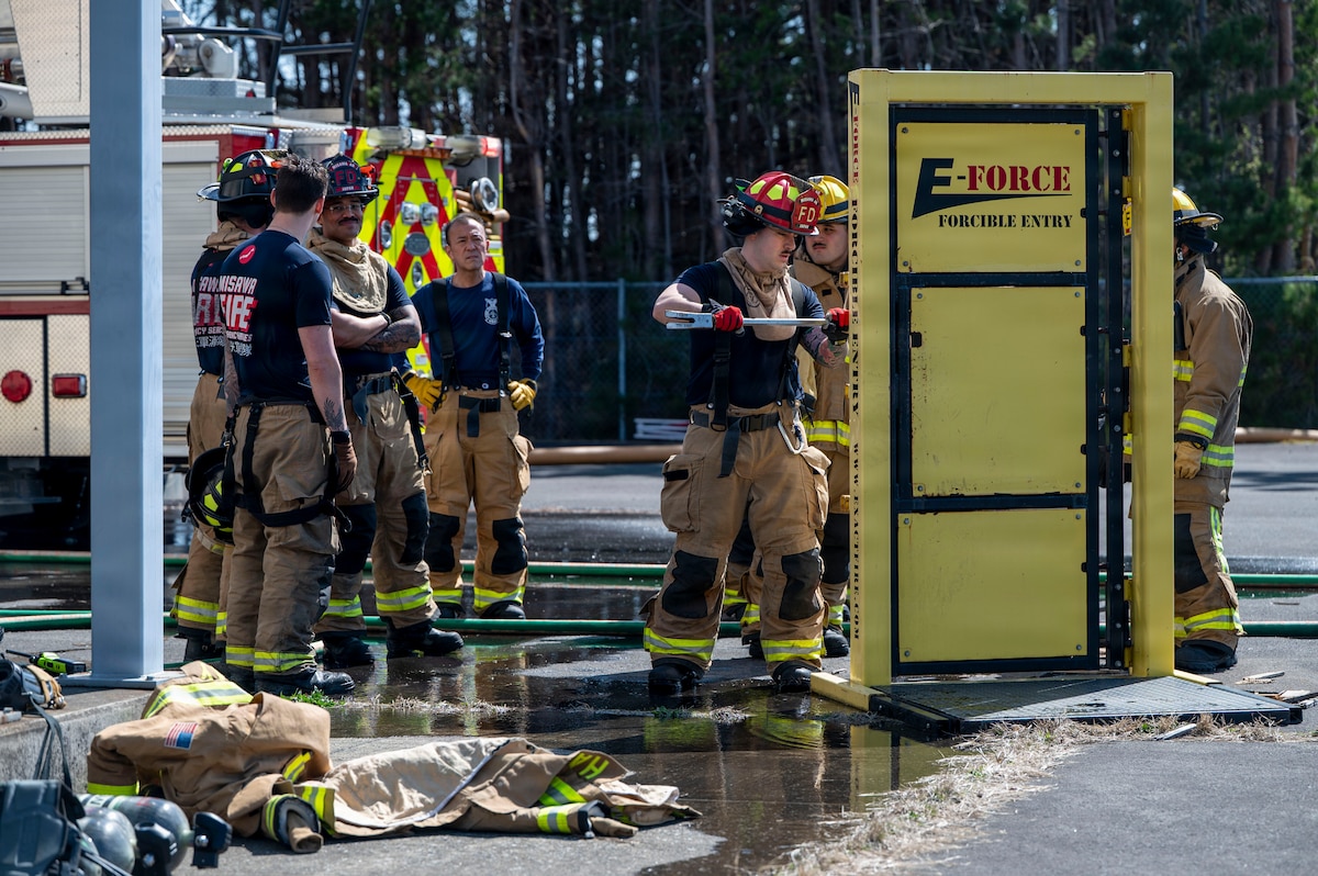 U.S. Air Force firefighters assigned to the 35th Civil Engineer Squadron demonstrate forcible entry during a bilateral first responder training event at Misawa Air Base, Japan, April 8, 2026. Mastery of lifesaving skills strengthens mission readiness and ensures fire emergency services remain prepared to respond in support of Indo-Pacific operations. (U.S. Air Force photo by Senior Airman Gavin Hameed)