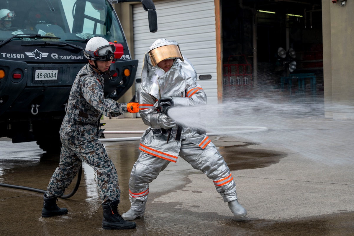 Firefighters from the U.S. Air Force 35th Civil Engineer Squadron and Japan Air Self-Defense Force 3rd Air Wing firefighters conduct a bilateral firefighter exchange at Misawa Air Base, Japan, April 8, 2026. The exchange gave participants firsthand experience learning about each other’s procedures and equipment while strengthening interoperability between the two units.(U.S. Air Force photo by Senior Airman Gavin Hameed)