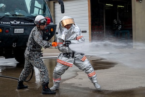 Firefighters from the U.S. Air Force 35th Civil Engineer Squadron and Japan Air Self-Defense Force 3rd Air Wing firefighters conduct a bilateral firefighter exchange at Misawa Air Base, Japan, April 8, 2026. The exchange gave participants firsthand experience learning about each other’s procedures and equipment while strengthening interoperability between the two units.(U.S. Air Force photo by Senior Airman Gavin Hameed)