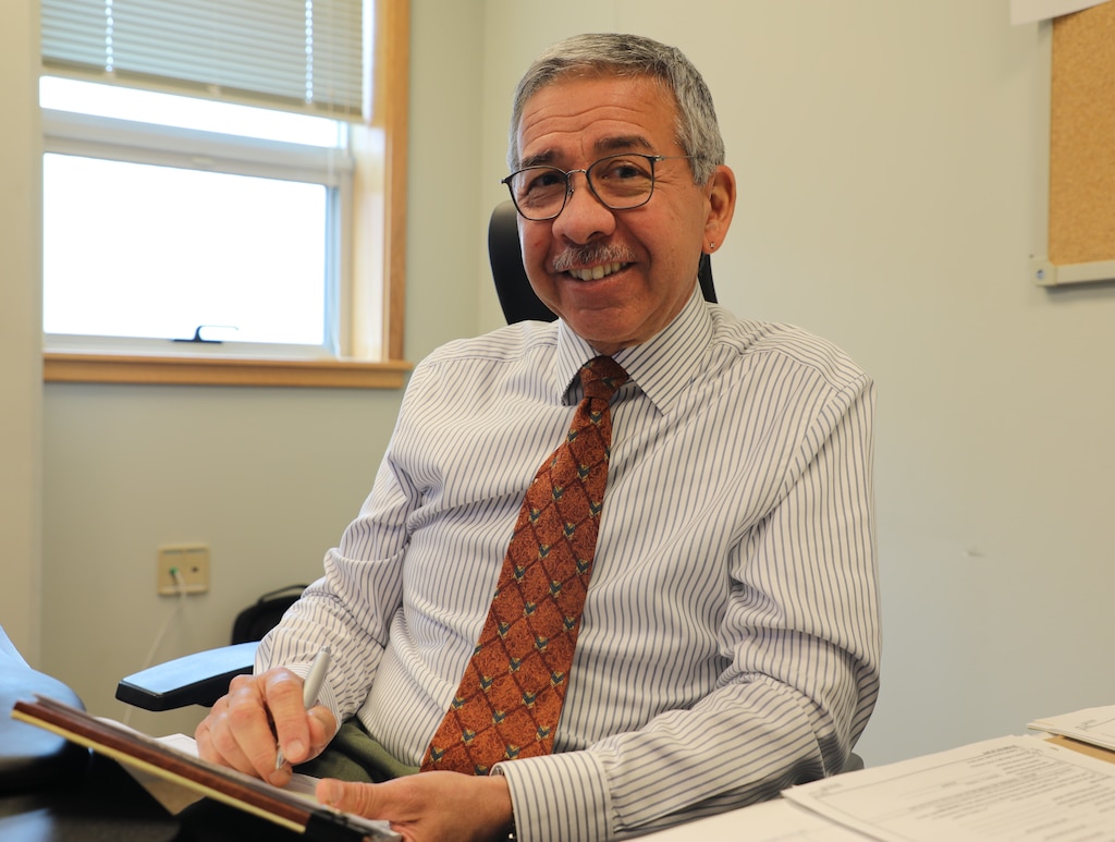 Larry Estrada, deputy district counsel, U.S. Army Corps of Engineers – Far East District, poses at his desk, expertly navigating the complexities of legal contracts and procurement. With over 30 years of legal expertise, Larry brings a wealth of knowledge and dedication to his role at the Far East District. (U.S. Army photo by Yohan An)