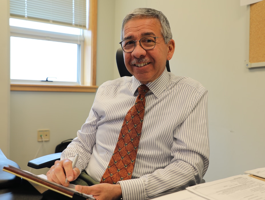 Larry Estrada, deputy district counsel, U.S. Army Corps of Engineers – Far East District, poses at his desk, expertly navigating the complexities of legal contracts and procurement. With over 30 years of legal expertise, Larry brings a wealth of knowledge and dedication to his role at the Far East District. (U.S. Army photo by Yohan An)
