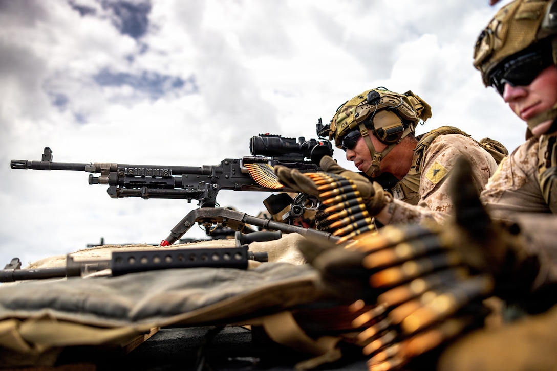 A U.S. Marine with Battalion Landing Team 3/5, 11th Marine Expeditionary Unit, prepares to fire an M240B machine gun during a live-fire range aboard Whidbey Island-class dock landing ship USS Comstock (LSD 45), in the Pacific Ocean, April 10, 2026. The 11th MEU, embarked aboard the Boxer Amphibious Ready Group, is a persistent, combat credible force contributing to deterrence and crisis response in the U.S. 7th Fleet area of operations. U.S. 7th Fleet, the U.S. Navy's largest forward-deployed numbered fleet, routinely interacts and operates with allies and partners to preserve a free and open Indo-Pacific. (U.S. Marine Corps photo by Sgt. Trent A. Henry)