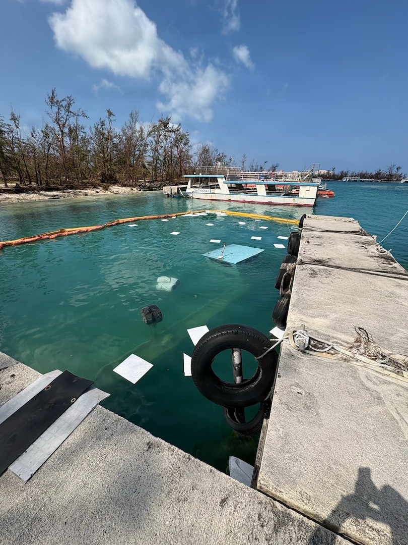 U.S. Coast Guard responders assess potential pollution from sunken vessels in Saipan on April 21, 2026. U.S. Coast Guard crews pressed north on April 19, 2026, ensuring the safety of Apra Harbor before moving toward communities still isolated by the effects of Super Typhoon Sinlaku, launching a coordinated surge to fully reopen ports across Guam and the Commonwealth of the Northern Mariana Islands and deliver resources. (U.S. Coast Guard photo by Lt. Justin Miller)